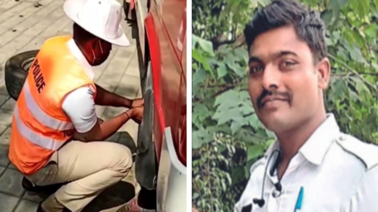 Polisi lalu lintas Kasappa Kallur membantu sopir ambulans mengganti ban bocor. (India Times)