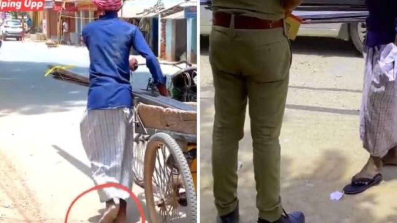 seorang polisi memberikan sepasang sandal baru kepada penarik gerobak yang berjalan tanpa alas kaki di jalan. (India Times)