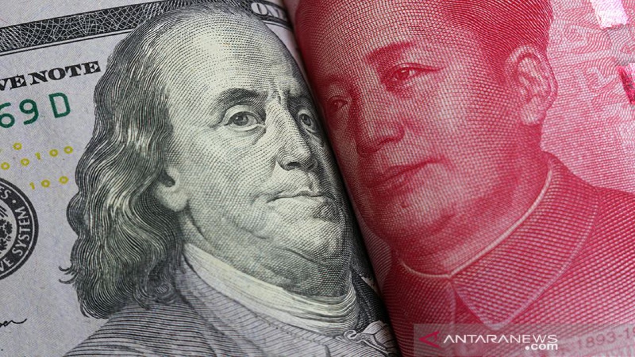 Mata uang Dolar AS dan Yuan China. (Foto/ANTARA/Shutterstock/rustamxakim/aa)