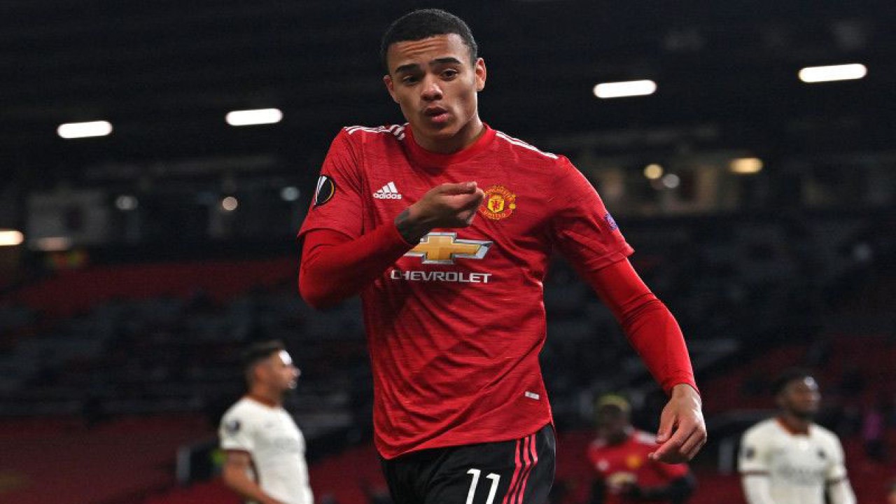 Manchester United's English striker Mason Greenwood celebrates after scoring their sixth goal during the UEFA Europa League semi-final, first leg football match between Manchester United and Roma at Old Trafford stadium in Manchester, north west England, on April 29, 2021. - Manchester United won the game 6-2. (Photo by Paul ELLIS / AFP) (AFP/PAUL ELLIS)