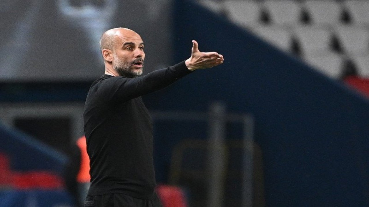 Pelatih Manchester City Pep Guardiola (Photo by Anne-Christine POUJOULAT / AFP) (AFP/ANNE-CHRISTINE POUJOULAT)