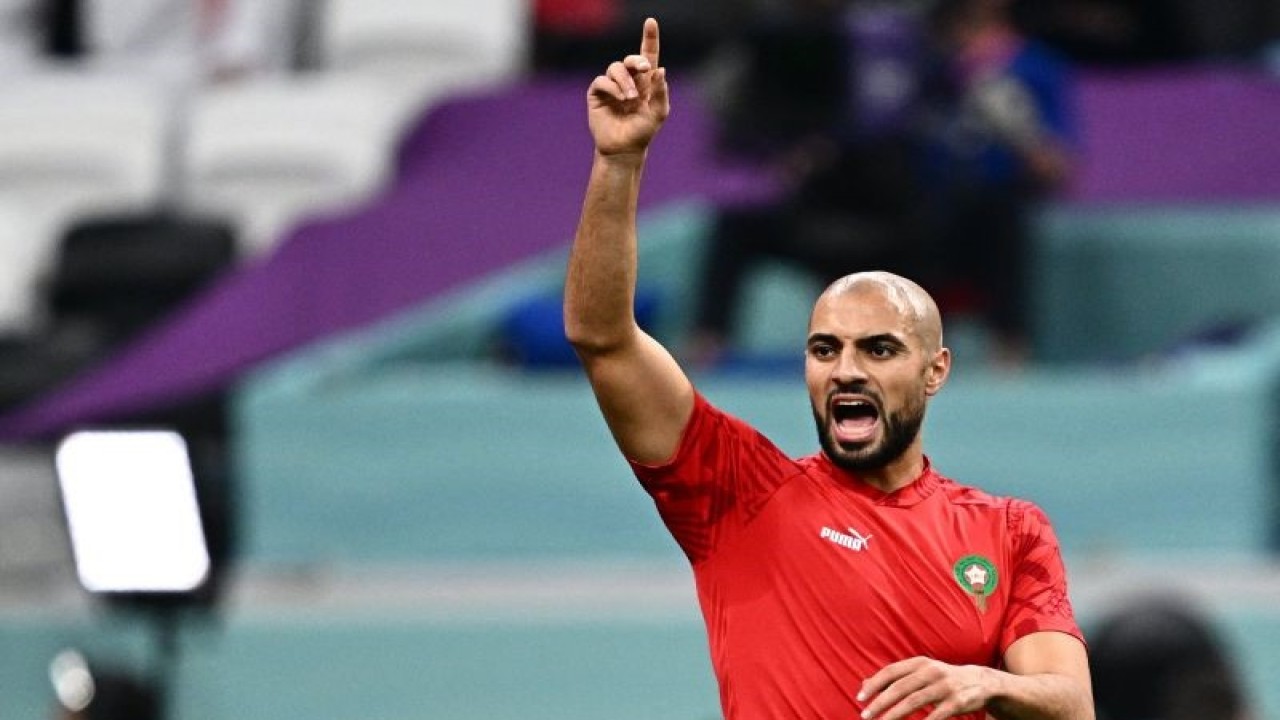 Morocco's midfielder #04 Sofyan Amrabat warms up ahead of the Qatar 2022 World Cup semi-final football match between France and Morocco at the Al-Bayt Stadium in Al Khor, north of Doha on December 14, 2022. (Photo by GABRIEL BOUYS / AFP) (AFP/GABRIEL BOUYS)