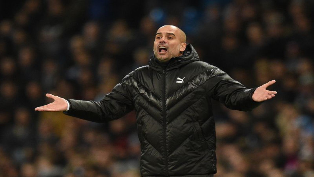 Pep Guardiola. ANTARA/AFP/OLI SCARFF