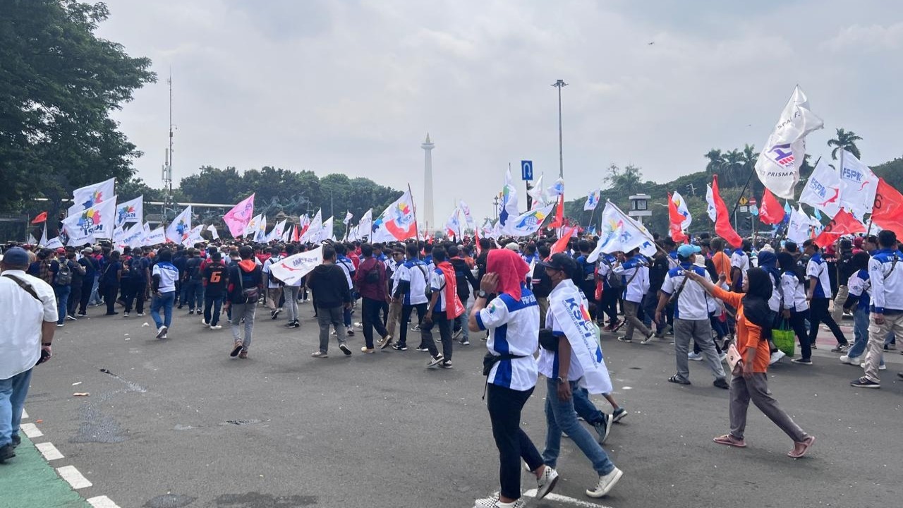 Para buruh mendatangi kawasan Patung Kuda, Monas, Jakarta Pusat untuk merayakan May Day.